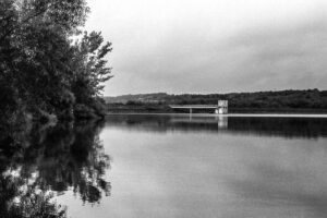 A black and white photo of the dam on Lake Galena at Peace Valley Park